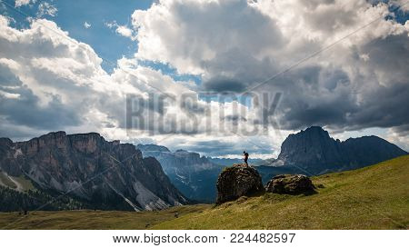 Standing in front of Dolomites mountains in Italy