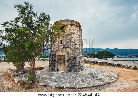 Ancient windmill on Kalydon Peninsula near Agios Nikolaos, Crete, Greece