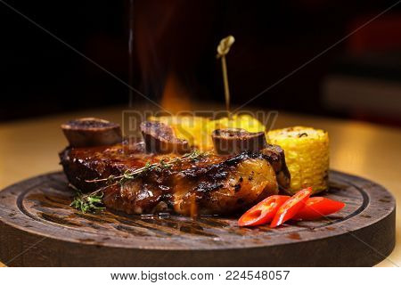 Restaurant dish. Fried ribs of marbled beef served with a twinkle