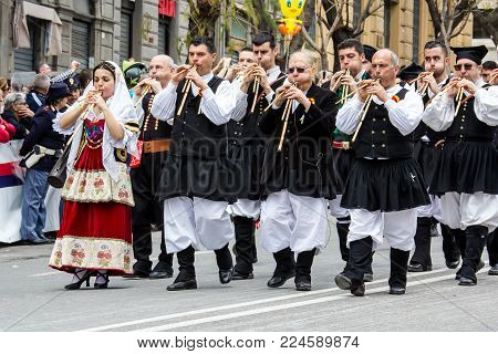 CAGLIARI, ITALY - MAY 1, 2016: 360 Festa di Sant'Efisio, launeddas musicians parading in traditional Sardinian costume - Sardinia