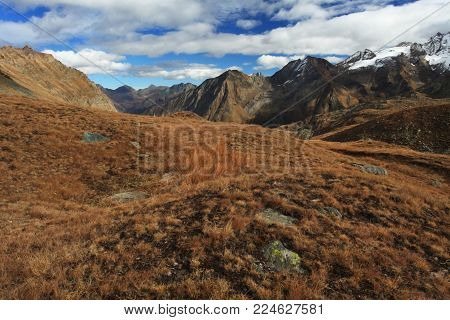 Gran Paradiso. Italian National Park. Beautiful landscape. Picture with sky. Autumn nature. Mountain landscape. Blue sky. Europe.