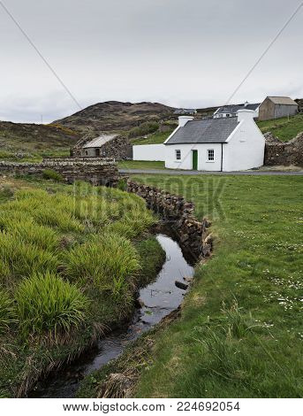 A beautiful little cottage found near Portsalon, set behind a pretty stream.