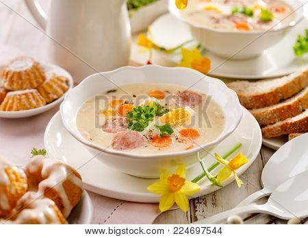 Polish Easter soup, white borscht with the addition of white sausage and a hard boiled egg.  Traditional Easter dish in Poland