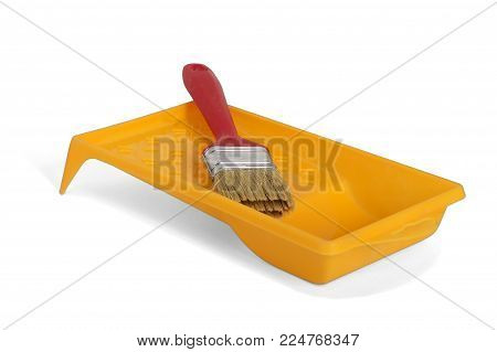 Brush In The Orange Paint Tray