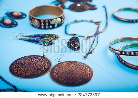 Female indian jewellery accessories on green and blue background