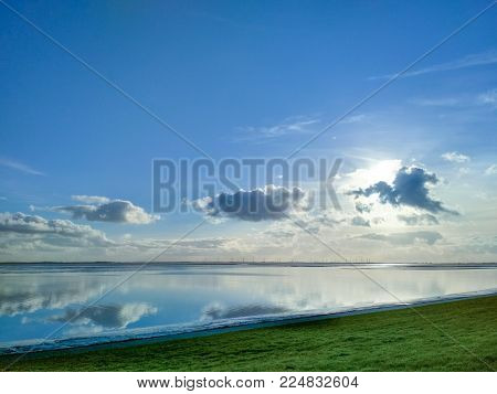Reflections in the water of Wilhelmshaven Beach, Suedstrand