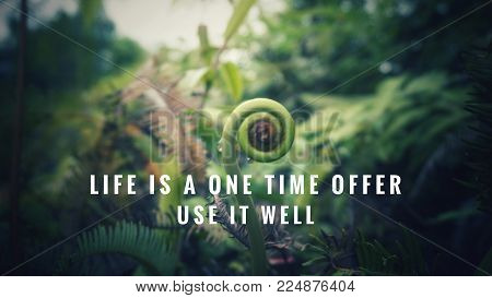 Motivational and inspirational quotes - Life is one time offer. Use it well. With blurred vintage styled background.