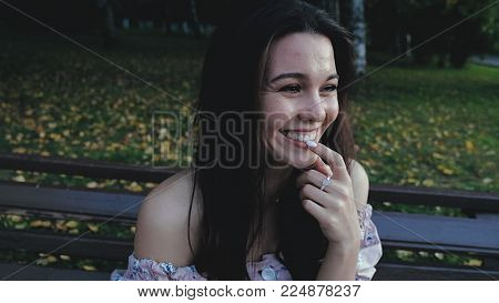 Happy beautiful woman walking in the city, steadicam shot 4k