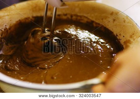 Chokolate Dough For Cake In Cooking Process With Mixer In Bowl