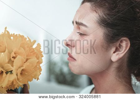 Woman After Getting Flowers From Husband Having Allergy