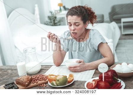 Woman Having Allergy To Some Ingredients During Breakfast