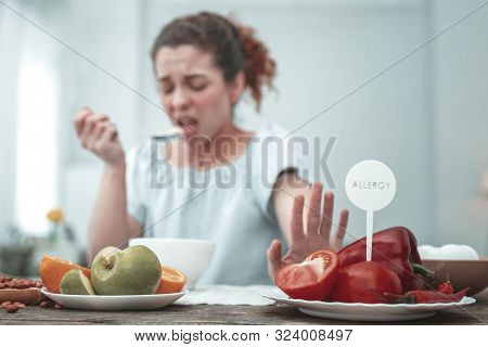 Curly Woman Having Skin Rash Because Of Red Vegetables