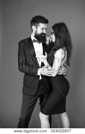 Elegance Is Not About Being Noticed. Award Ceremony Concept. Bearded Man Wear Suit Girl Elegant Dres