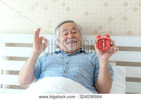 Senior Man Feel Happy Good Health Wake Up In The Morning Enjoying Time In His Home Indoor Bedroom Ba