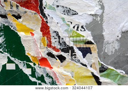 A Colourful Photo Of Textures Created By Layers Of Torn Advertising Posters On A Billboard Backgroun
