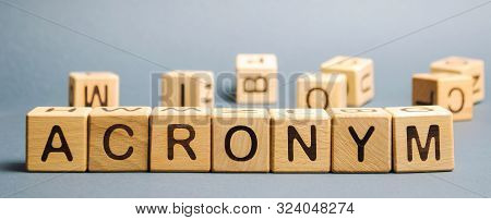 Wooden Blocks With The Word Acronym. Abbreviation From The Initial Components Of A Phrase Or A Word.
