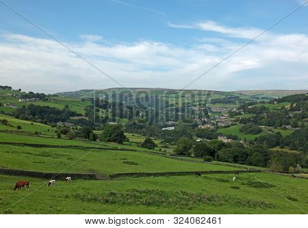 A View Of The Village Of Cragg Vale In The Calder Valley Surrounded By Trees And Fields