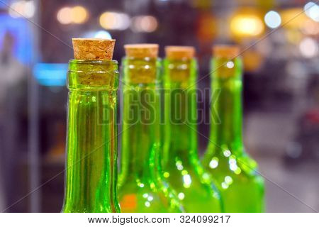 The Necks Of Wine Bottles With Corks.
