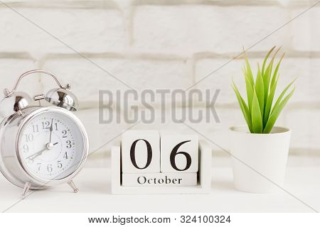 The Sixth Of October On The Wooden Calendar Next To The Alarm Clock, The Sixth Day Of The Second Aut