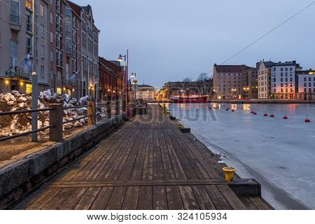 Helsinki, Finland- 28 February 2015: Wooden Catwalk Along Kanavaranta Street In Helsinki Marina. Red