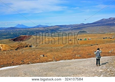 Kamchatka Peninsula, Russia -- 13 September 2019: Tourists In The Hills In Kamchatka. Travel In Thes