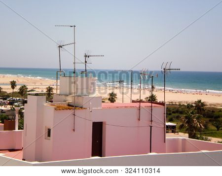 Beautiful White Marine Houses With Background The Beach And The Sea In Conil De La Frontera. July 13