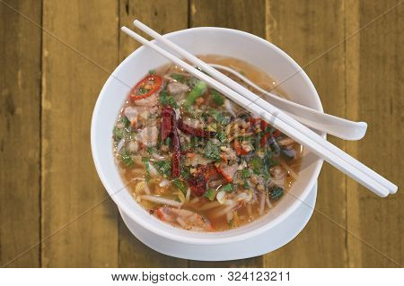Hot And Spicy Tomyam Nooddle In White Bowl.