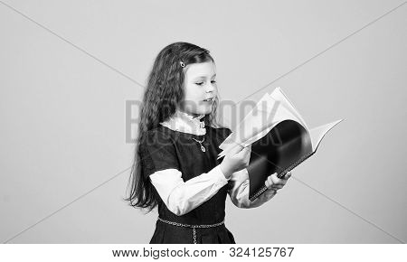 Searching For Information.knowledge And Education. Back To School. Hometwork. Serious Small Girl Wan