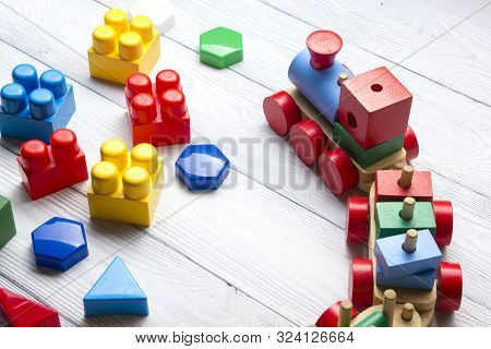 Kids Educational Developing Toys Frame On White Background. Top View. Flat Lay. Copy Space For Text