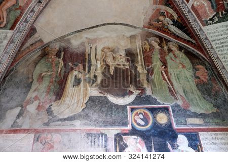 BRESSANONE, ITALY - JULY 14, 2018: Virgin Mary with baby Jesus and Saints, fresco in the cloister, Cathedral of Santa Maria Assunta i San Cassiano in Bressanone, Italy