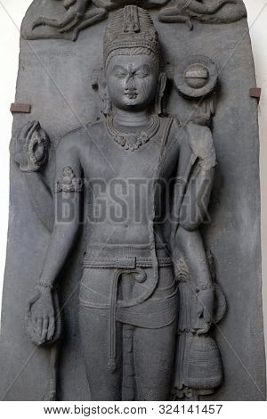 KOLKATA, INDIA - FEBRUARY 09: Standing Avalokitesvara, from 9th century found in Basalt Surakund, Nalanda, Bihar now exposed in the Indian Museum in Kolkata, West Bengal, India on February 09, 2016.