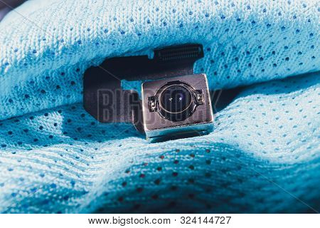 Close-up Of Camera Sensor Chip On Cloth Background.