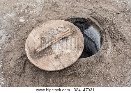 Closeup Of A Lid Partially Covering A Hole In Which Cozido Das Furnas Is Cooked On The Island Of São
