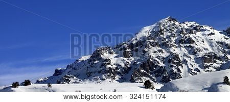 Panoramic View On Snowy Off-piste Slope, Snow Rocks And Blue Sky On Sunny Winter Day. Caucasus Mount