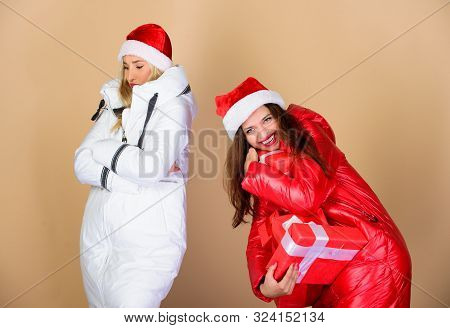 Great Present. Women In Down Jacket. Girls Santa Hat. Christmas Fashion. Warm Clothing. Fun And Gift