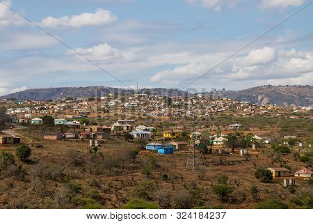 Housing And Huts Scattered Informally On Hill In Rural South Africa