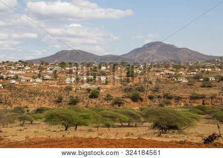 Housing And Huts Scattered Informally Over Hills In Rural South Africa