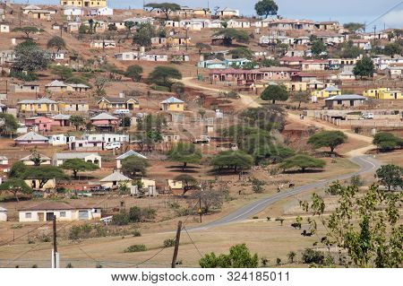 Housing And Huts Scattered Informally Over Hilly Area In Rural South Africa