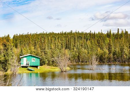 Small Remote Wilderness Cabin At Lake Front In Peel River Valley Of Northwest Territories, Nwt, Cana