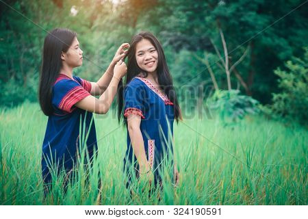 Portrait Of Young Girls Enjoy Playing In The Mist Of Foresst Outdoor At Countryside Of Thailand