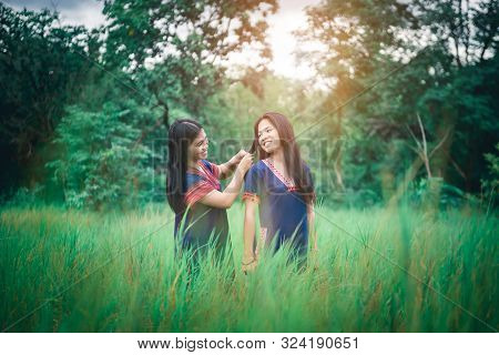 Portrait Of Young Girls Enjoy Playing In The Mist Of Foresst Outdoor At Countryside Of Thailand