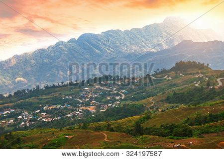 Sunset Of Panoramic View Mountain Range With Village On Nature Trail In Phu Thap Buek National Park 