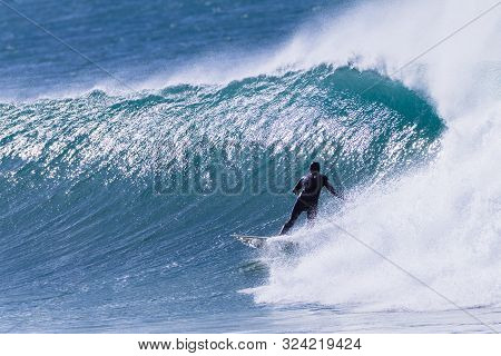 Surfer Surfing Rides Cold Wave