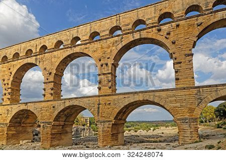 Remoulins, France, September 20, 2019 : The Pont Du Gard, The Highest Roman Aqueduct Bridge, And One