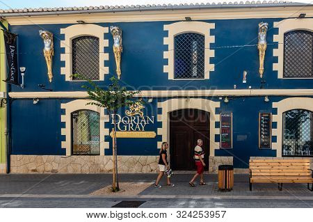 Denia, Valenciana, Spain - Sept 23 2019 : Dorian Gray Restaurant In Streets Of Denia With Tourists W