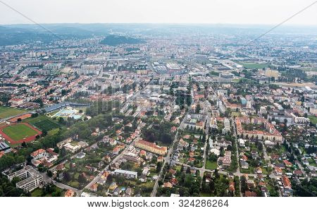 Aerial View Of City Graz From Helicopter Drone With District Eggenberg With Swimming Pool On A Cloud