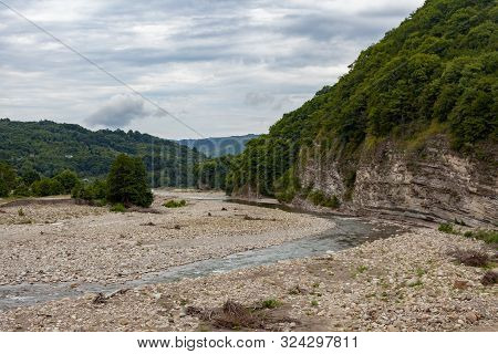 Mountain Stonebed Of River At The Cloudy Summer Day