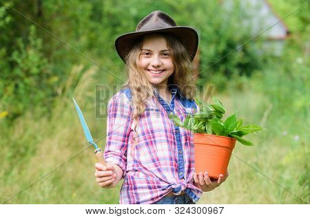Gardening. Farming And Agriculture. Spring Season. Hellow Summer. Small Girl Planting With Shovel. E