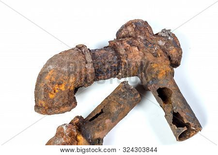 Fragments Of Old Cast-iron Water Pipes On White Background. After Many Years Of Operation Corroded M