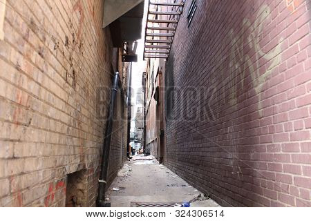 Skinny Alley Pathway With Grafitti Shady Sketchy